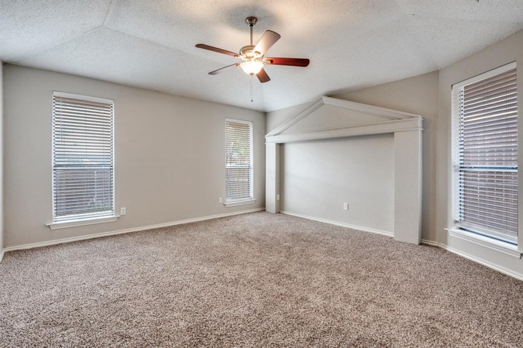 2118 Falcon Ridge Drive Carrollton, TX 75010 - Photo 11 of 18 an empty room with closet and a ceiling fan