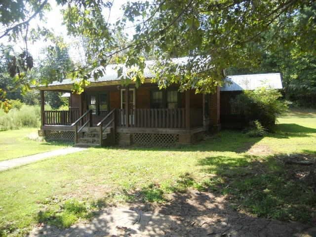 2231 Lebanon Road Epworth, GA 30541 - Photo 1 of 1 a view of a house with backyard and garden