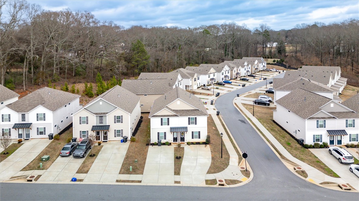215 Royal Way Pendleton, SC 29670 - Photo 25 of 33 An aerial perspective showcases a neat neighborhood of uniform homes with individual driveways and green spaces.