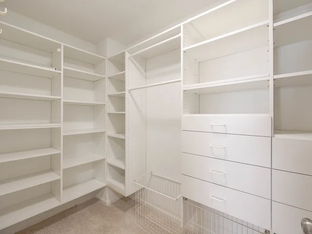 a view of an empty walk in closet