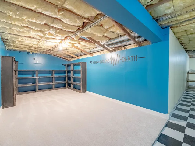 a view of an empty room with a bedroom