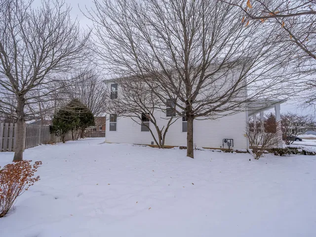 a view of a house with a snow yard