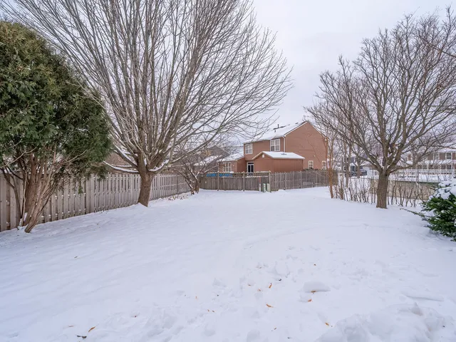 a view of a snow with snow on the road