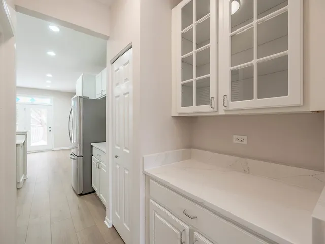 a kitchen with a refrigerator and countertop