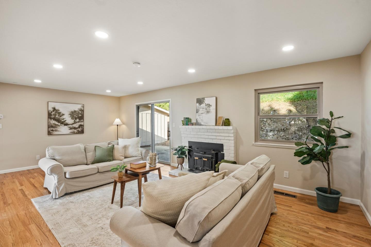 5152 Felter Road San Jose, CA 95132 - Photo 12 of 43 a living room with furniture a potted plant and a fireplace