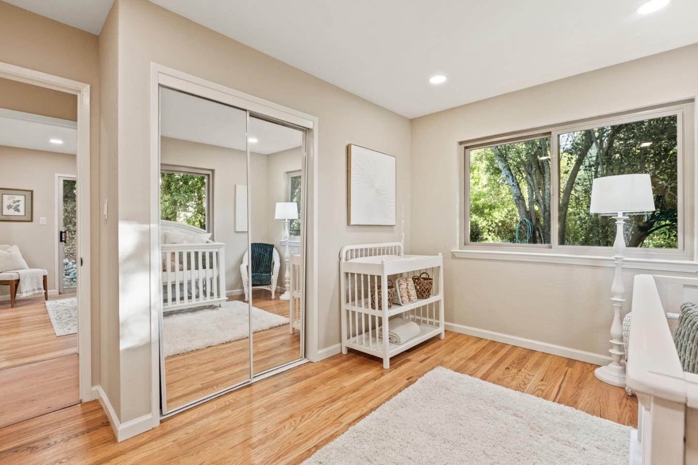 5152 Felter Road San Jose, CA 95132 - Photo 19 of 43 a view of a bedroom with wooden floor and windows