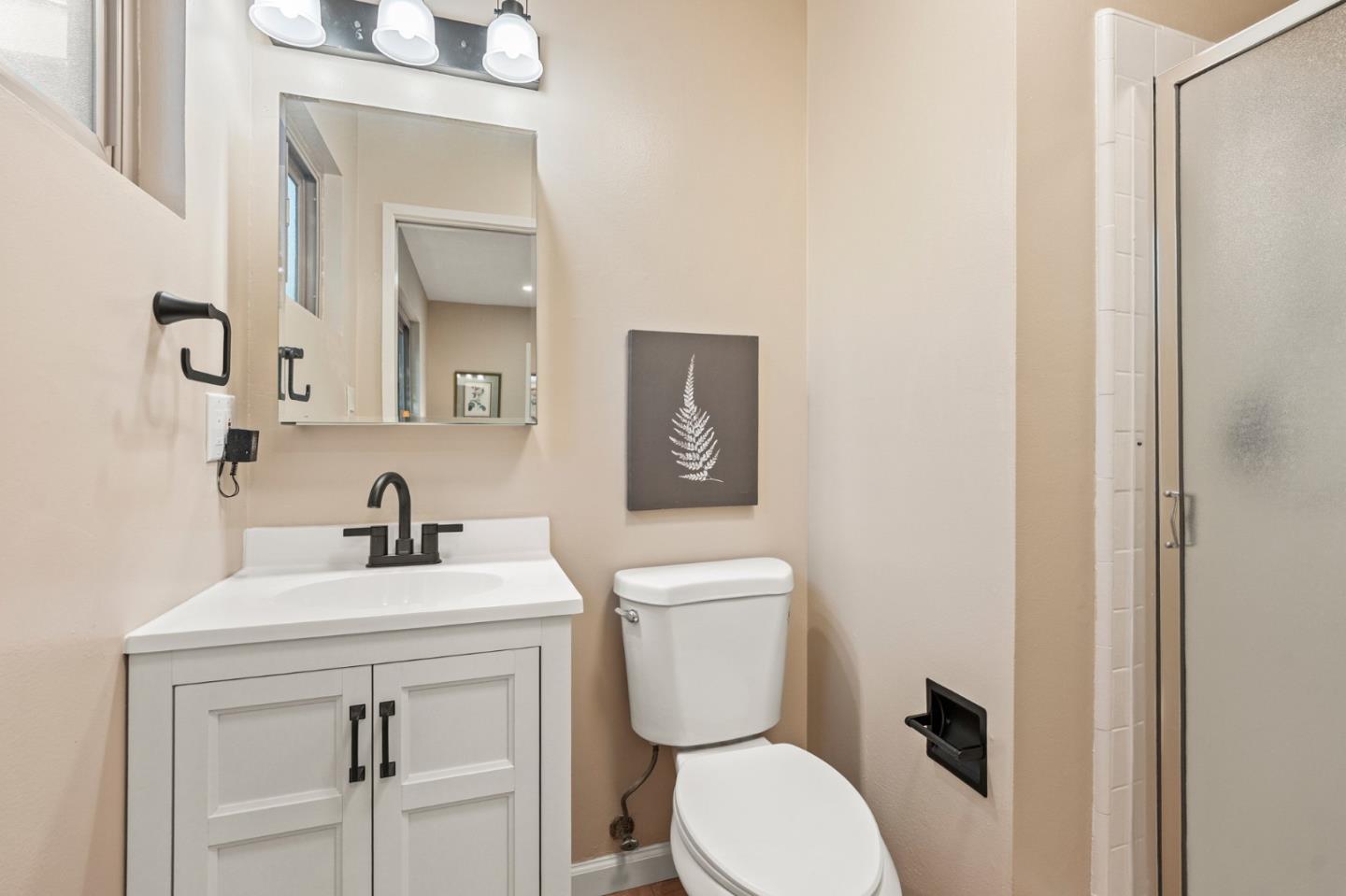 5152 Felter Road San Jose, CA 95132 - Photo 21 of 43 a bathroom with a toilet sink vanity and mirror