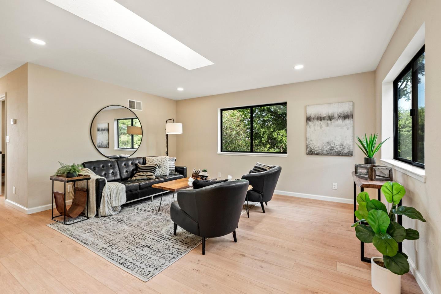 5152 Felter Road San Jose, CA 95132 - Photo 23 of 43 a living room with furniture a chandelier a large window and a potted plant