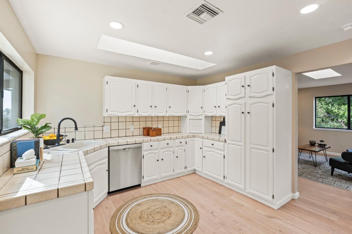 5152 Felter Road San Jose, CA 95132 - Photo 25 of 43 a large white kitchen with cabinets
