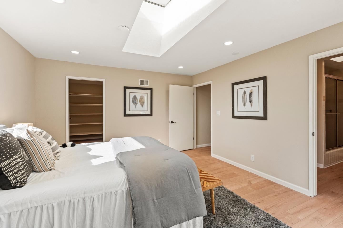 5152 Felter Road San Jose, CA 95132 - Photo 30 of 43 a bedroom with a large bed and painting on the wall