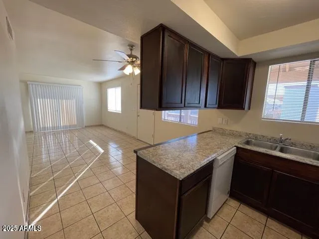 a kitchen with a sink a cabinets and window
