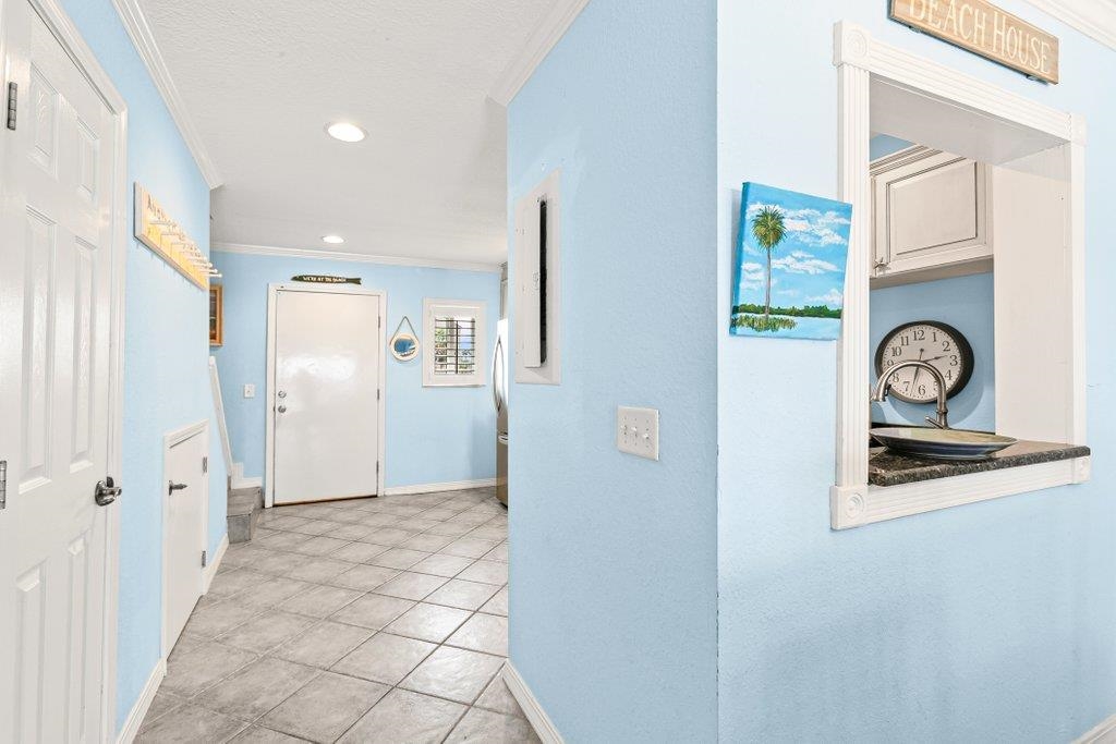 8550 A1A South, Unit 208 St. Augustine, FL 32080 - Photo 13 of 56 a view of a hallway to a bedroom with window