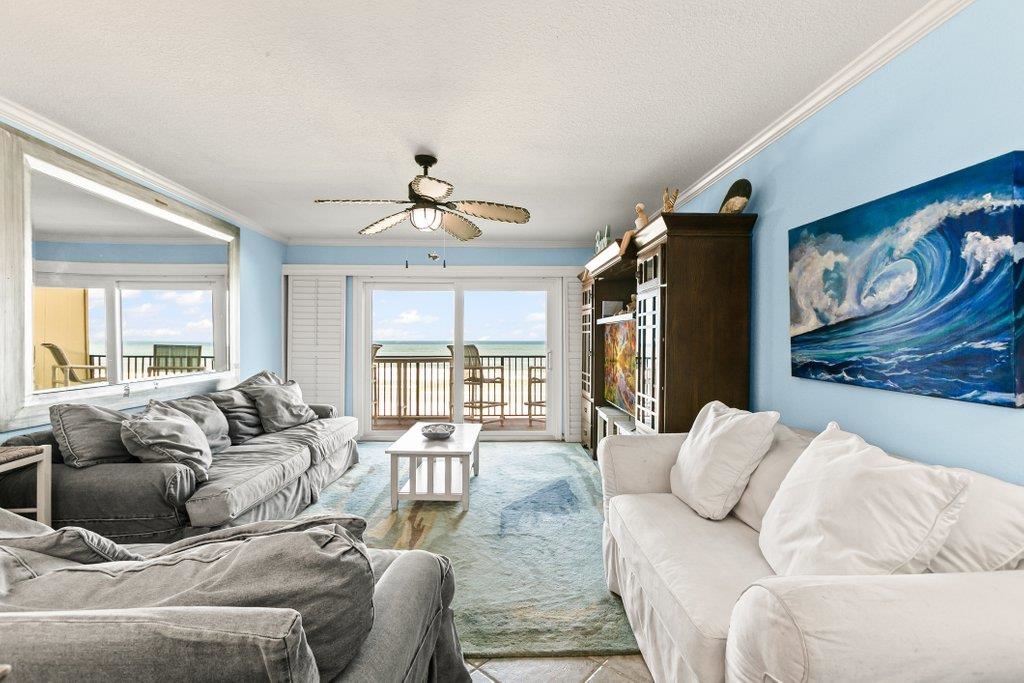 8550 A1A South, Unit 208 St. Augustine, FL 32080 - Photo 17 of 56 a living room with furniture and a large window