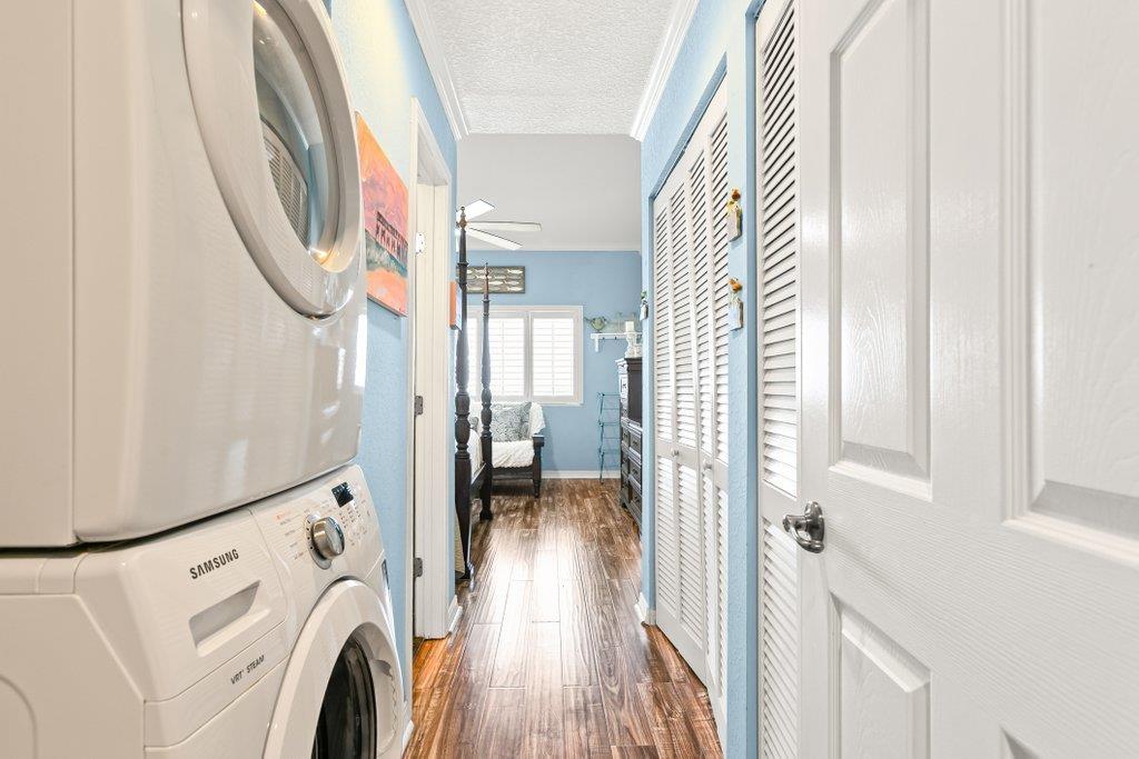 8550 A1A South, Unit 208 St. Augustine, FL 32080 - Photo 33 of 56 a view of a hallway with washer and dryer
