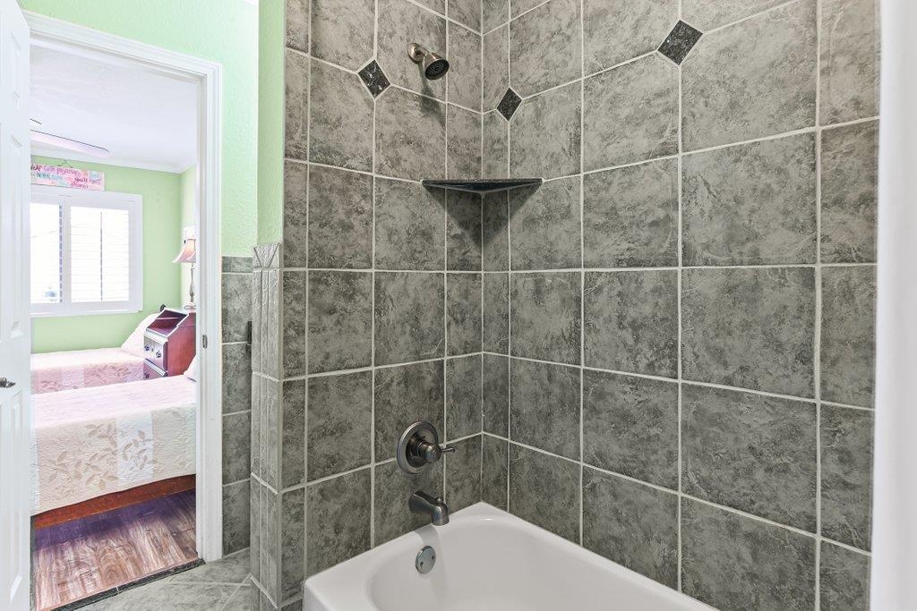 8550 A1A South, Unit 208 St. Augustine, FL 32080 - Photo 41 of 56 a bathroom with a shower