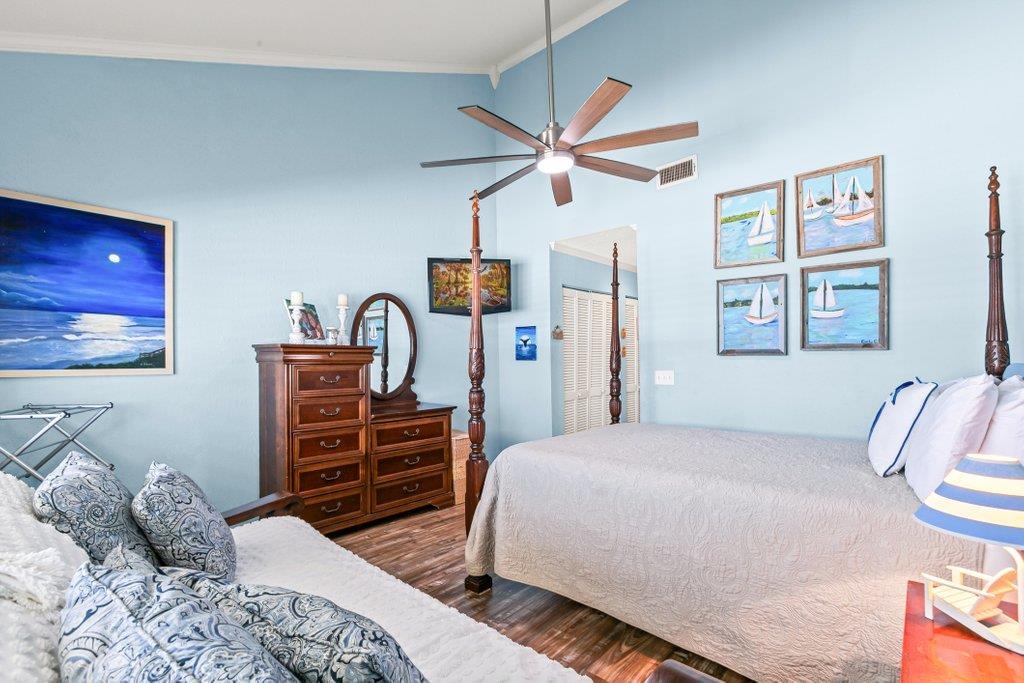 8550 A1A South, Unit 208 St. Augustine, FL 32080 - Photo 5 of 56 a bedroom with a bed and a dresser