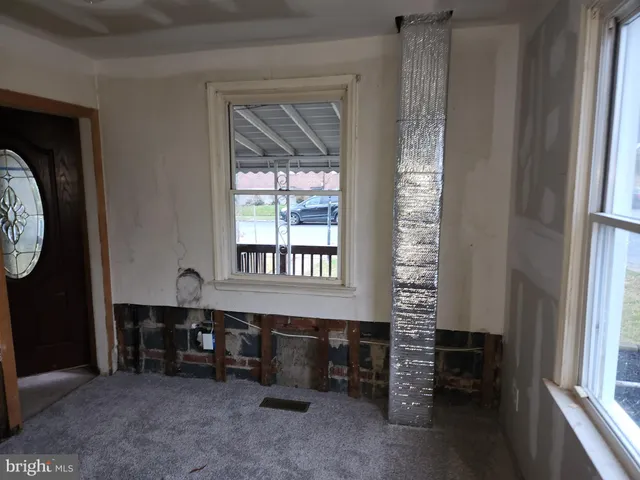 a room with furniture and a window