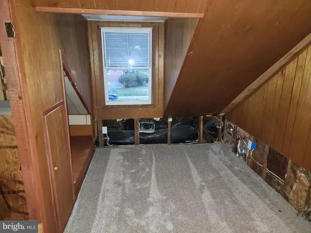 a view of an empty room with a fireplace