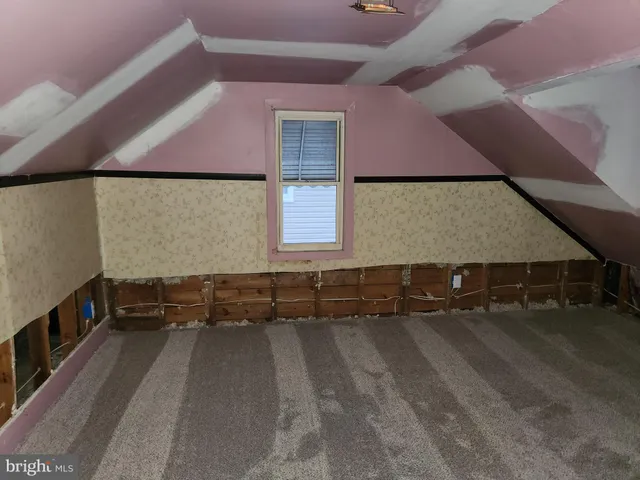 a view of an empty room with stairs