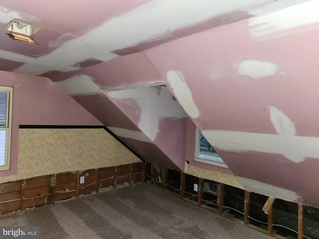 a view of room with a ceiling fan and window