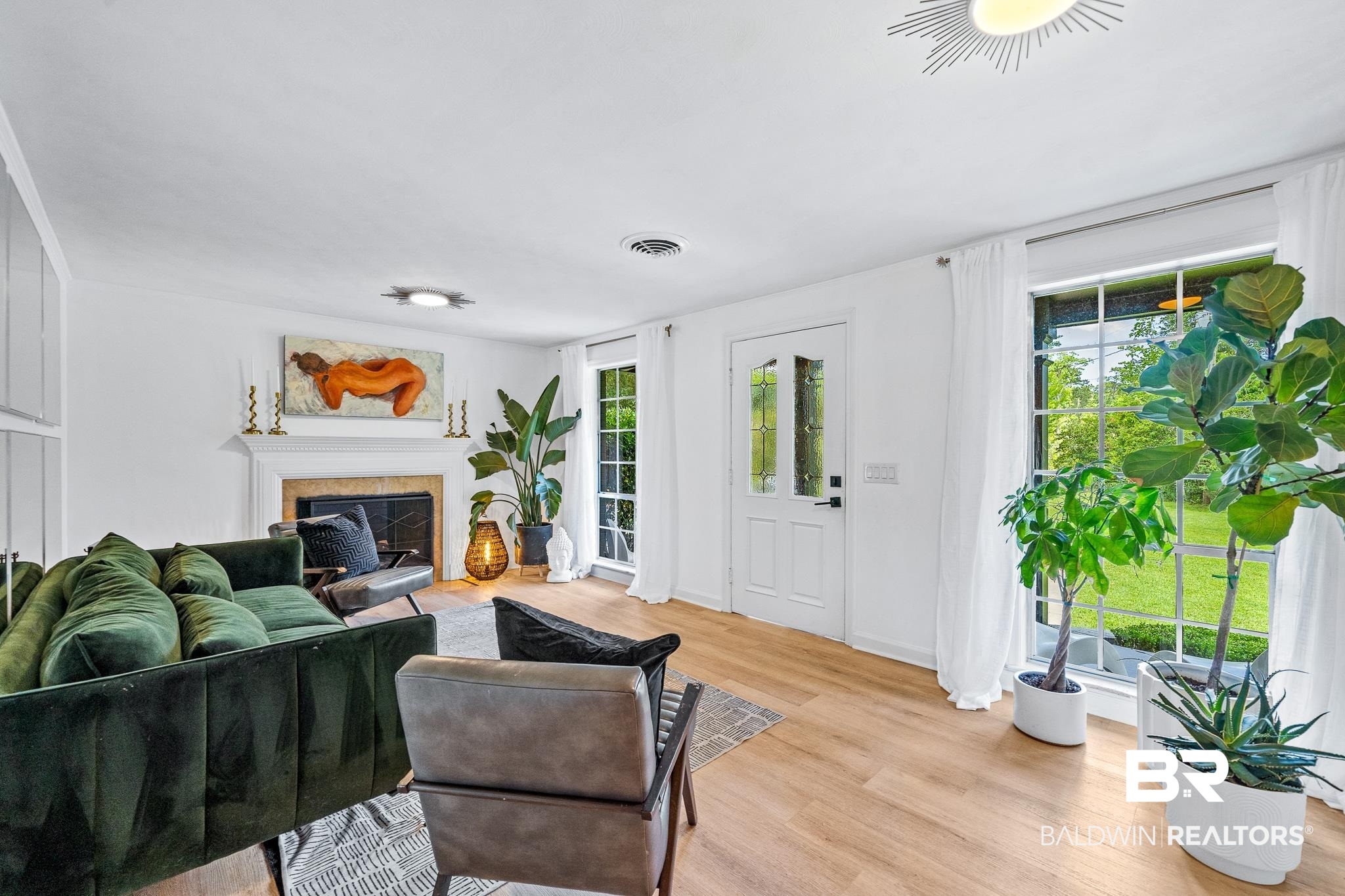 18513 Yacht Club Road Foley, AL 36535 - Photo 6 of 53 Living room with a tile fireplace and light wood-type flooring
