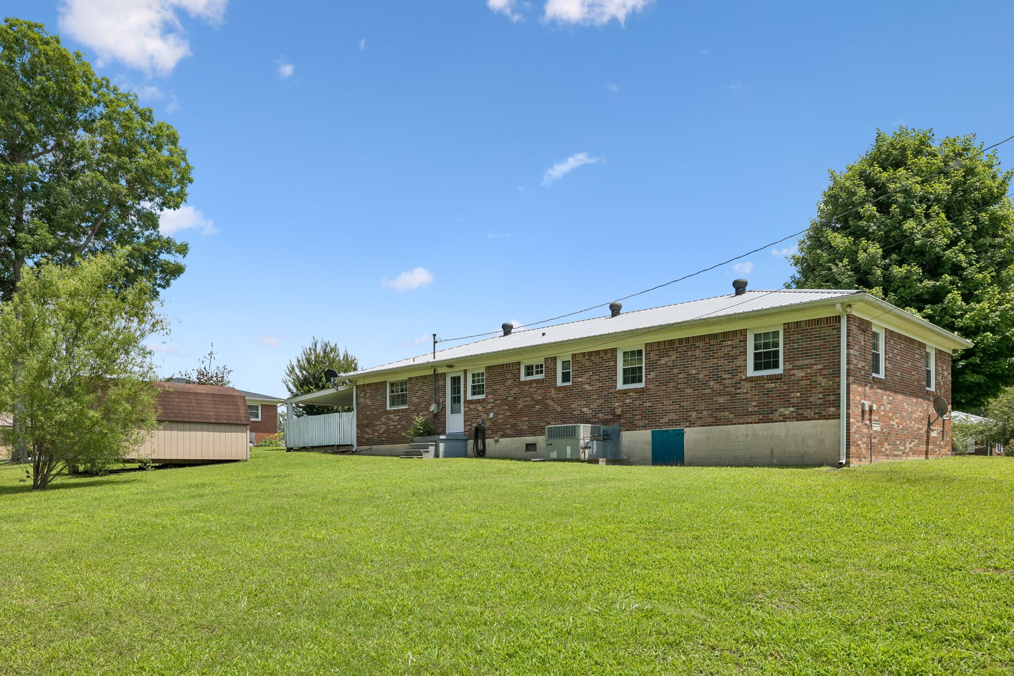 708 Hickory Street Centerville, TN 37033 - Photo 35 of 57 a front view of a house with a yard