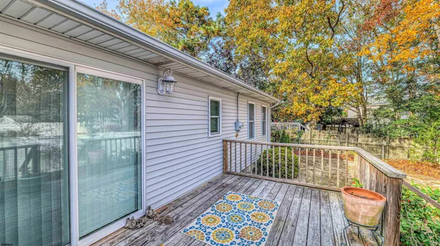 a view of a balcony with wooden floor
