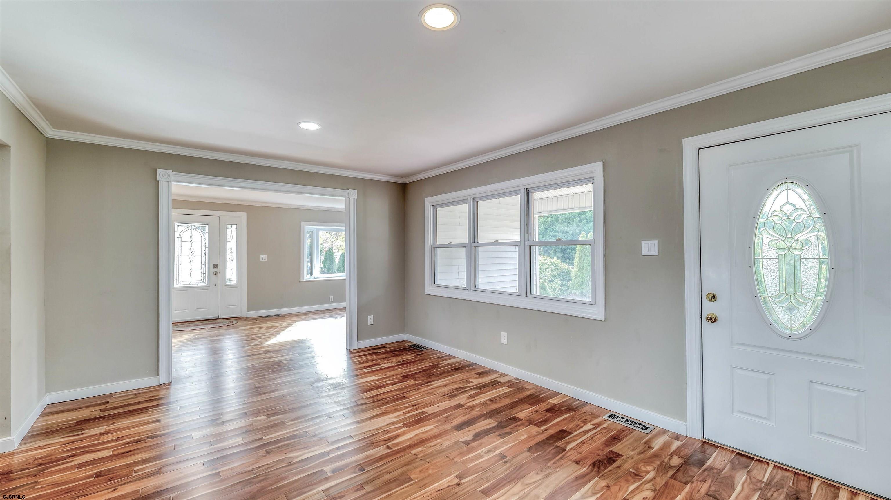 906 New Road Somers Point, NJ 08244 - Photo 17 of 32 a view of empty room with wooden floor and fan