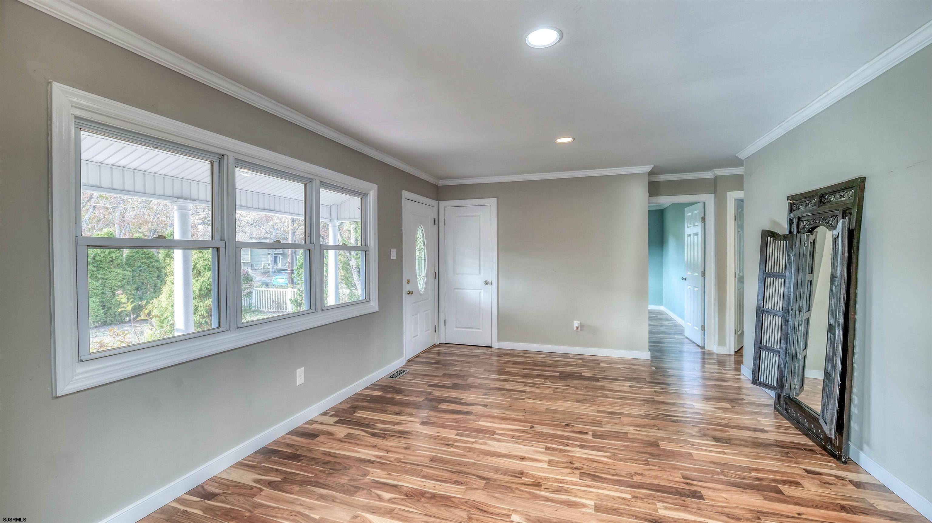 906 New Road Somers Point, NJ 08244 - Photo 18 of 32 a view of empty room with wooden floor and fan