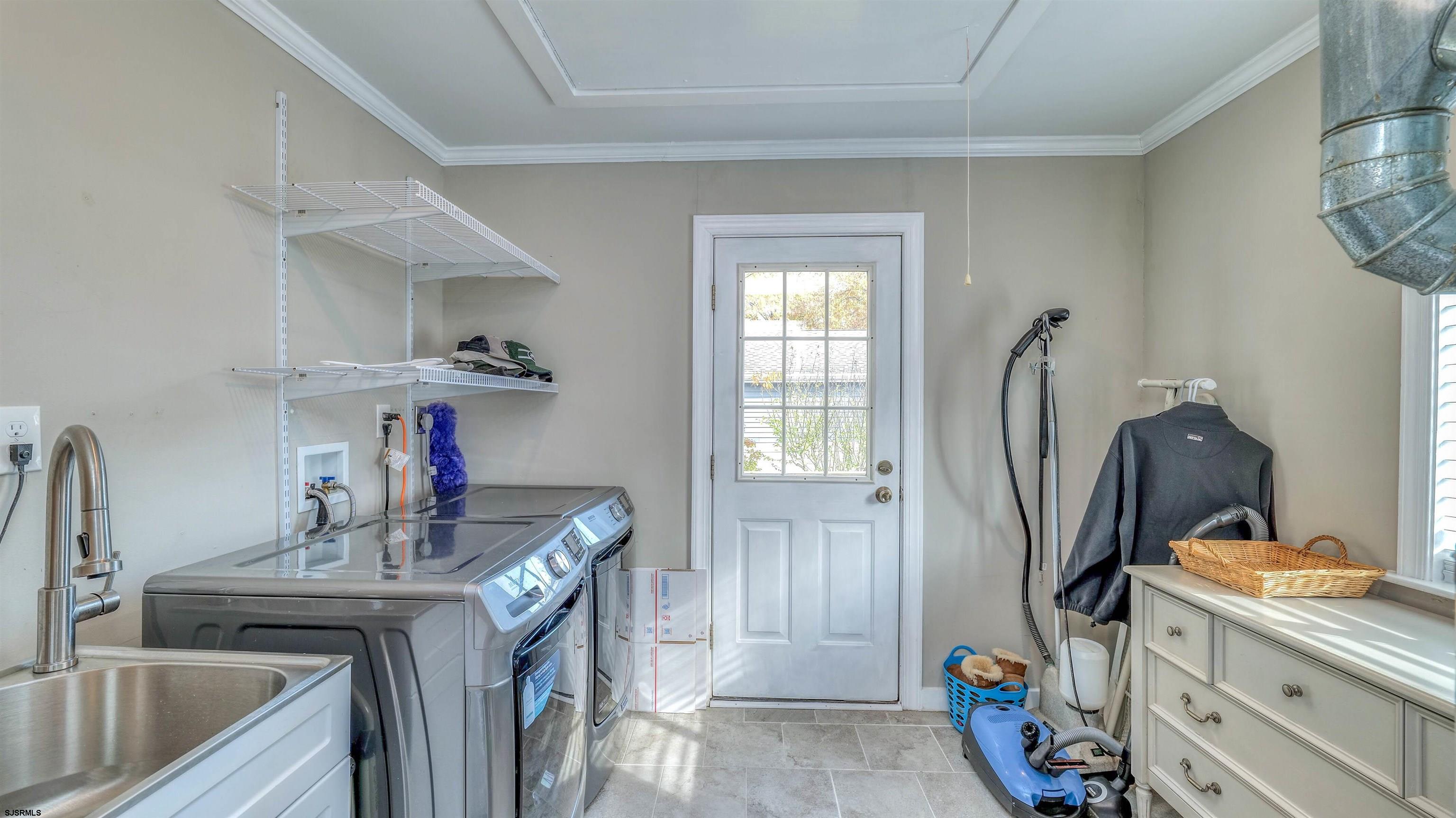 906 New Road Somers Point, NJ 08244 - Photo 23 of 32 a kitchen with a sink stove and refrigerator