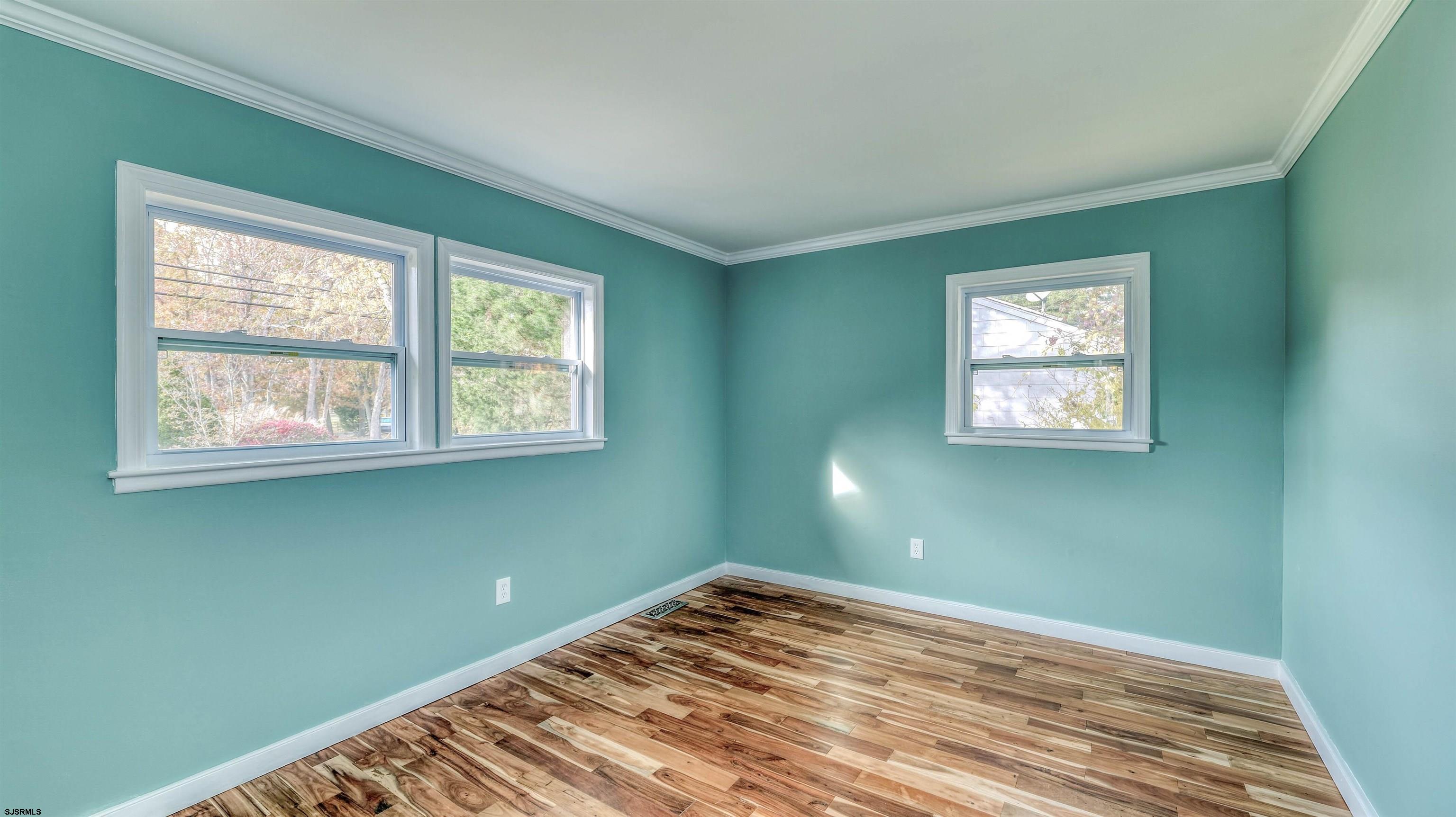 906 New Road Somers Point, NJ 08244 - Photo 24 of 32 a view of a room with wooden floor and windows