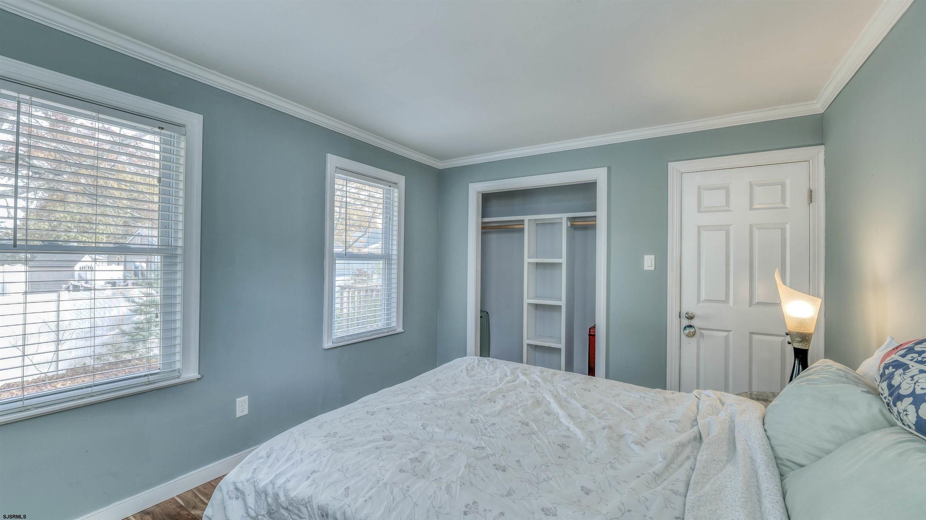 906 New Road Somers Point, NJ 08244 - Photo 27 of 32 a bedroom with a bed and a window