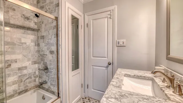 a bathroom with a bathtub and a shower