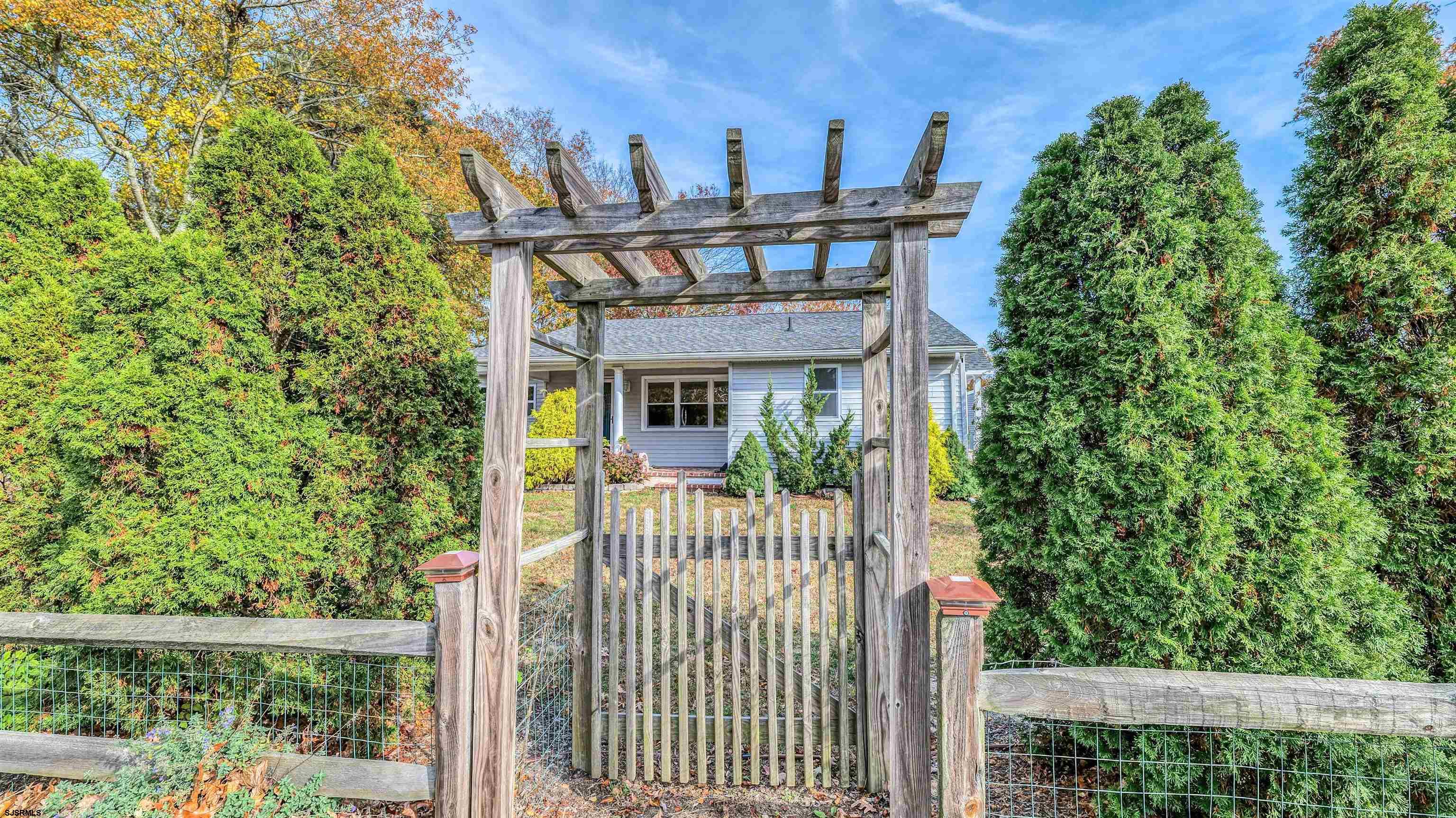906 New Road Somers Point, NJ 08244 - Photo 32 of 32 a view of a house with a small yard and plants