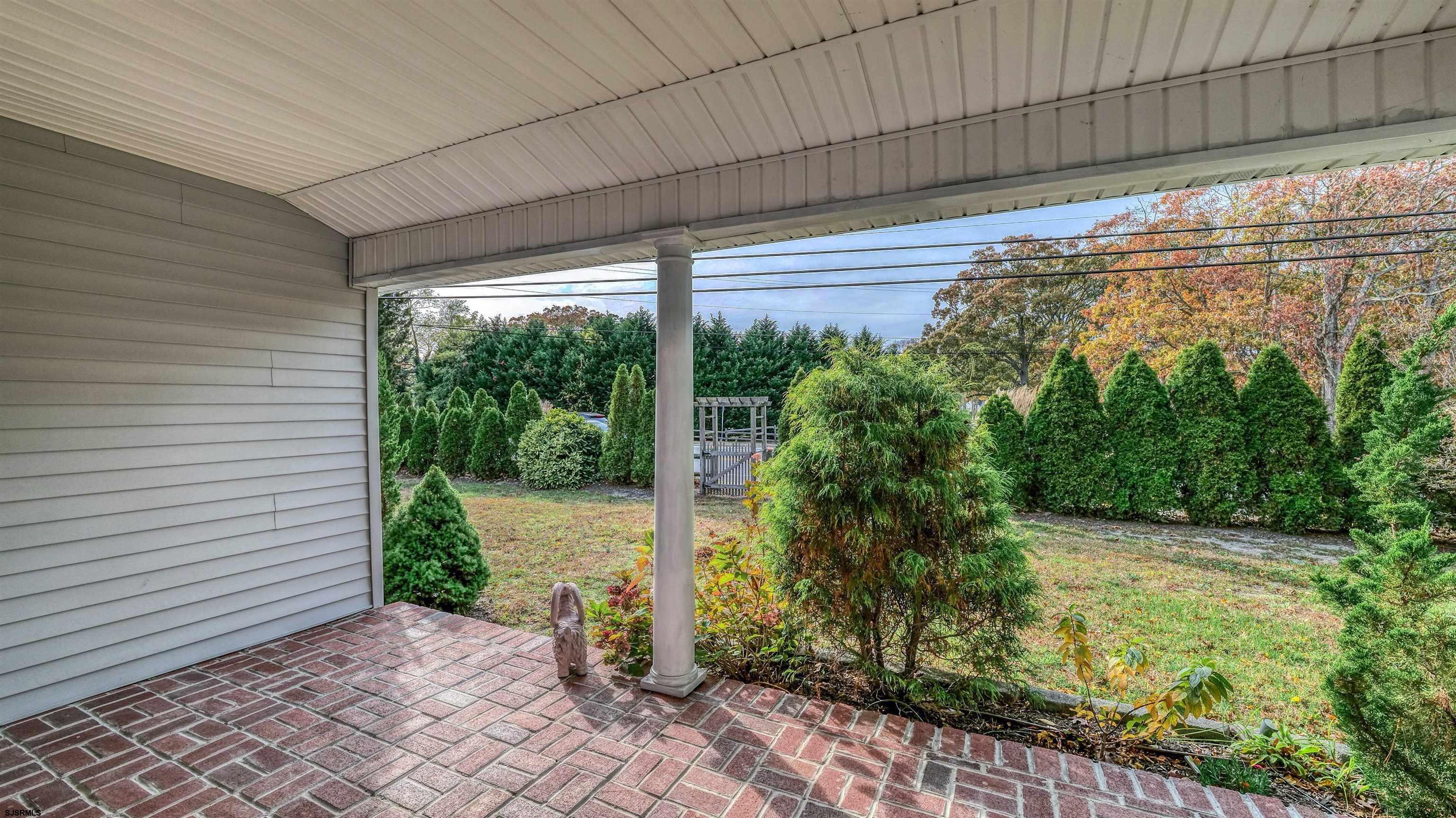 906 New Road Somers Point, NJ 08244 - Photo 4 of 32 a house view with a garden space