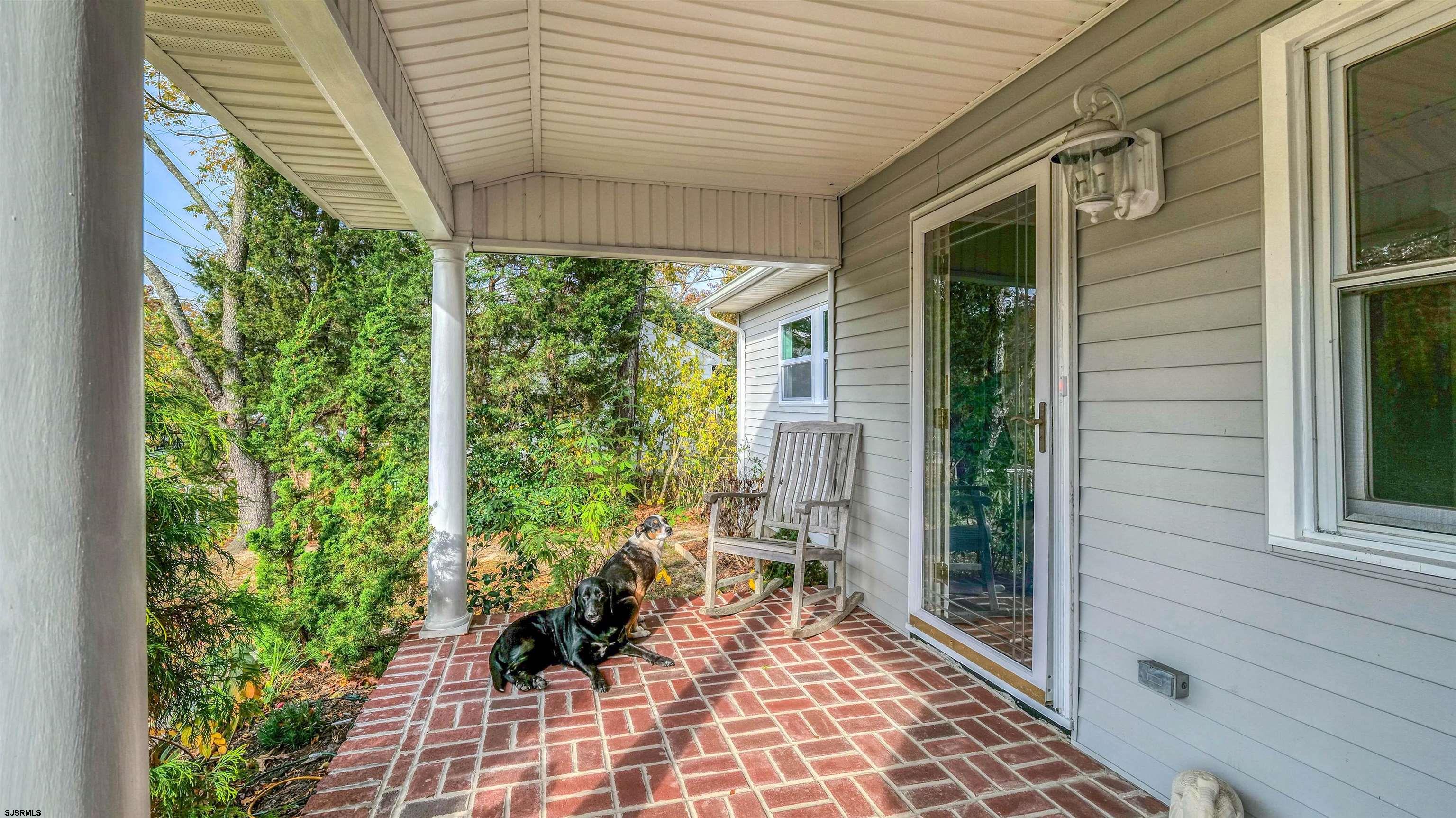 906 New Road Somers Point, NJ 08244 - Photo 5 of 32 a front view of a house with garden