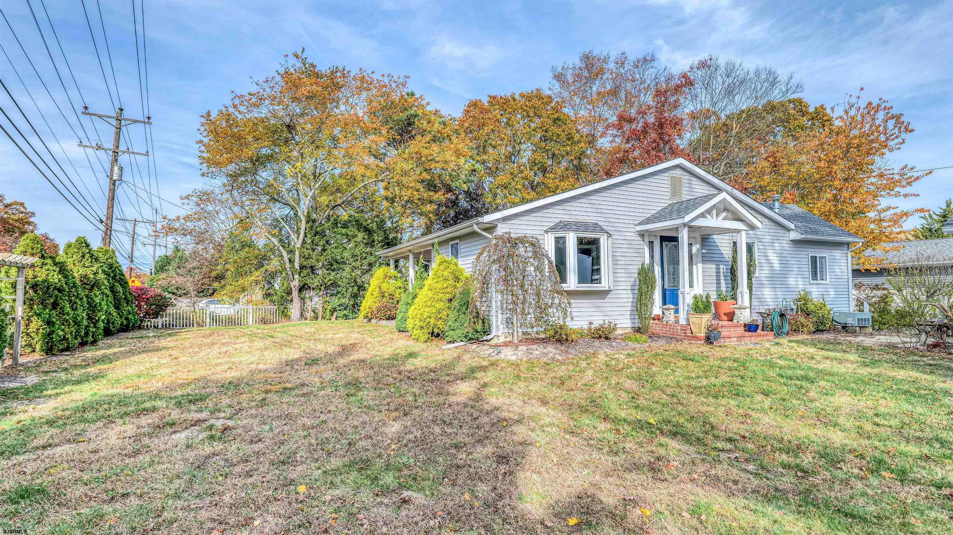 906 New Road Somers Point, NJ 08244 - Photo 6 of 32 a view of a house with a yard and sitting area