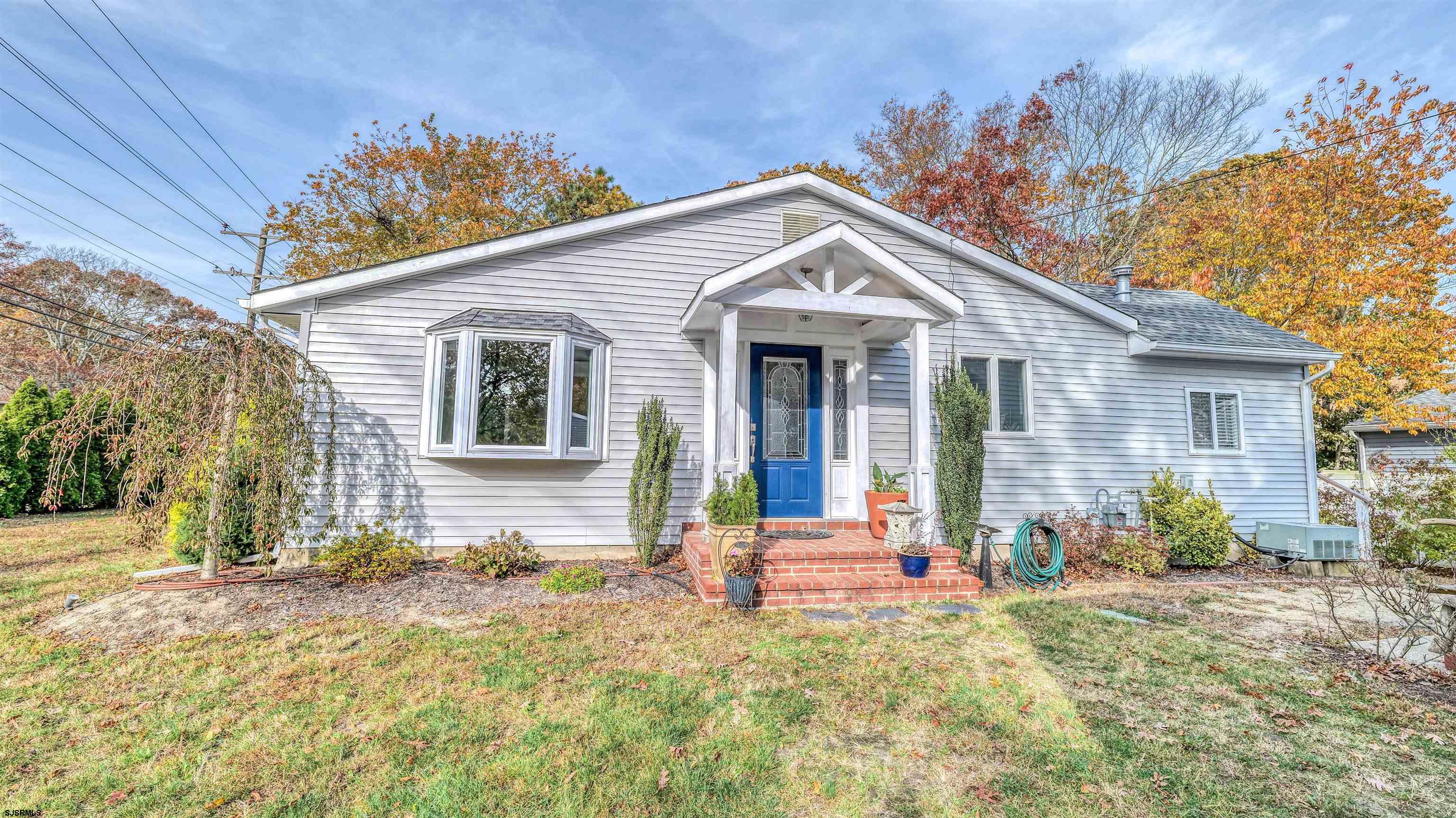 906 New Road Somers Point, NJ 08244 - Photo 7 of 32 a front view of a house with garden