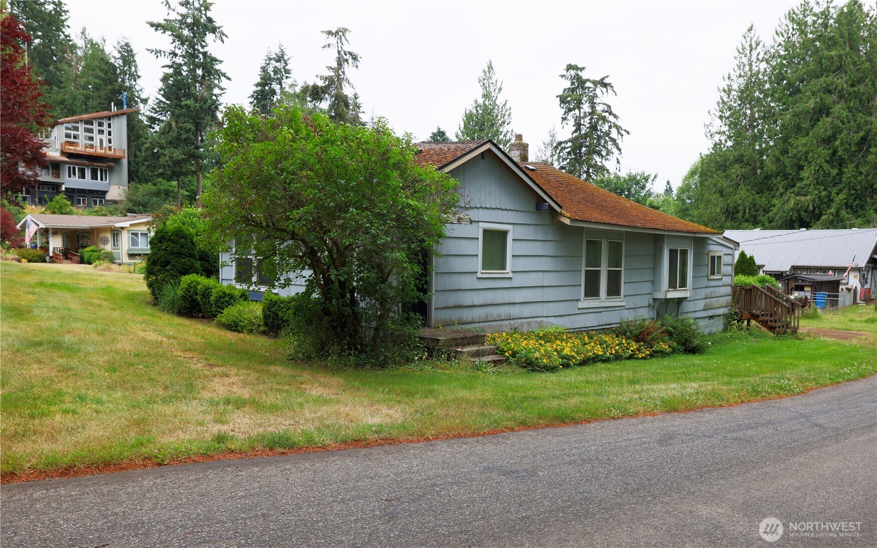 81 Hunt Road Port Hadlock, WA 98339 - Photo 4 of 20 a view of a house with a yard and potted plants