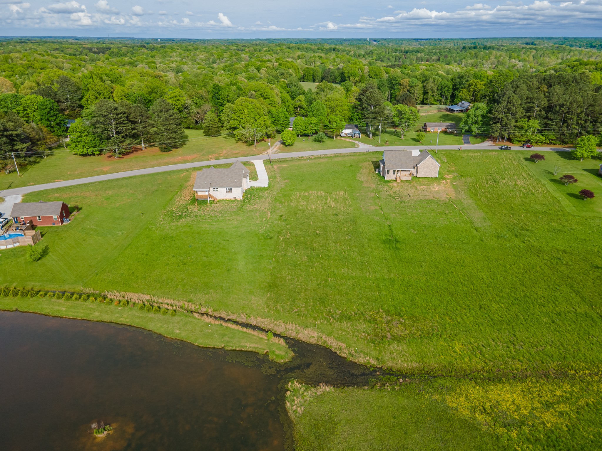 0 Long Branch Road Lawrenceburg, TN 38464 - Photo 4 of 6 a view of a lake with a big yard