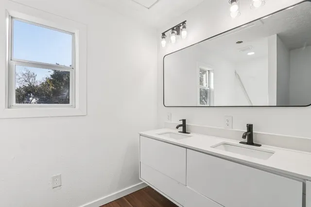 a bathroom with a sink and mirror