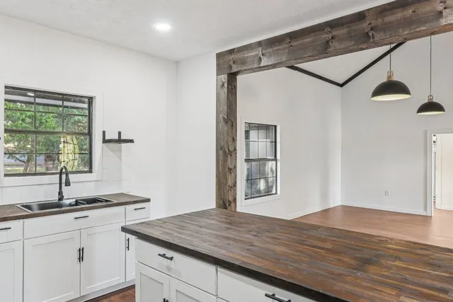 a kitchen with a sink and cabinets