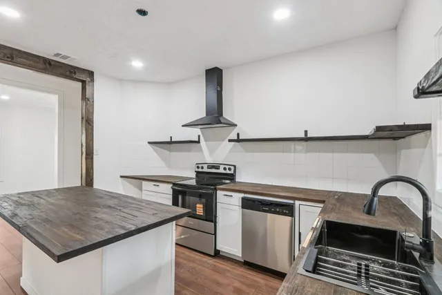 a kitchen with a stove and a kitchen island