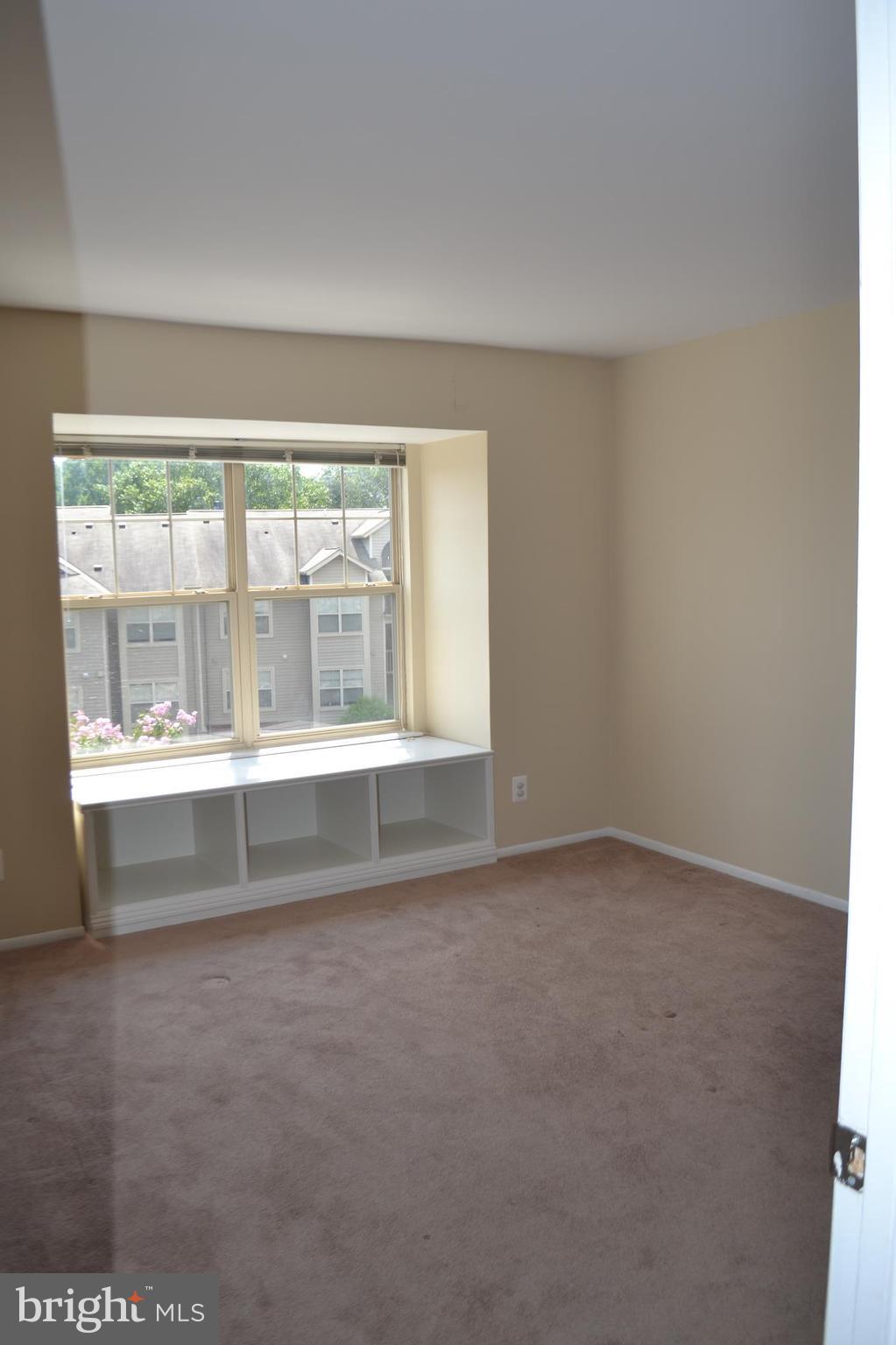 1704 Ascot Way, Unit F Reston, VA 20190 - Photo 9 of 18 Master bedroom with built in seat