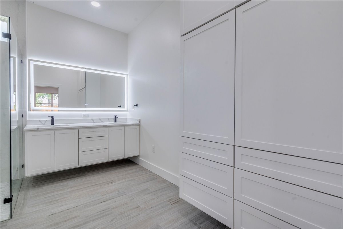 1215 Howard Street Taylor, TX 76574 - Photo 13 of 37 a bathroom with a sink and a mirror