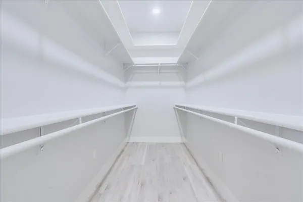 a bathroom with a shower sink and mirror