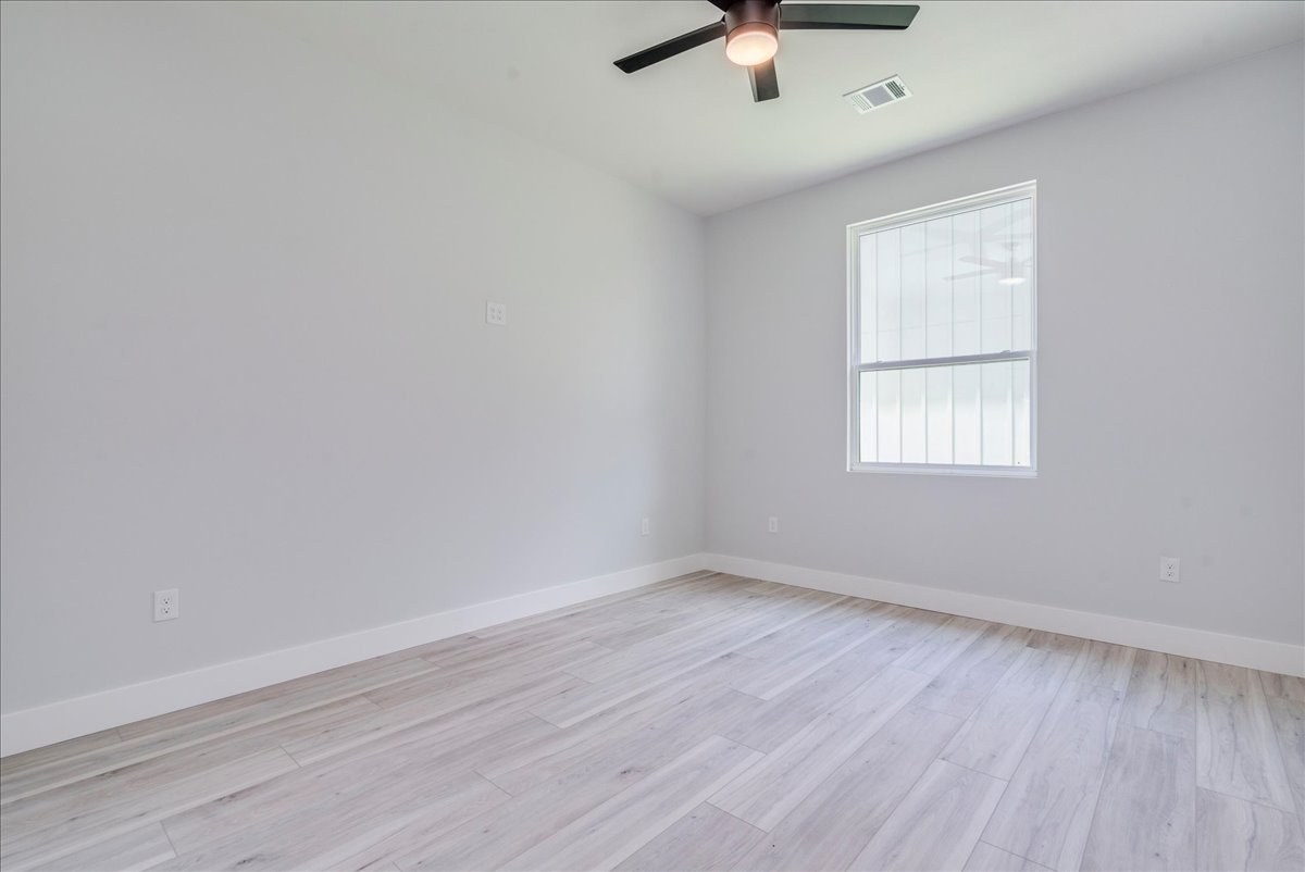 1215 Howard Street Taylor, TX 76574 - Photo 16 of 37 an empty room with a window