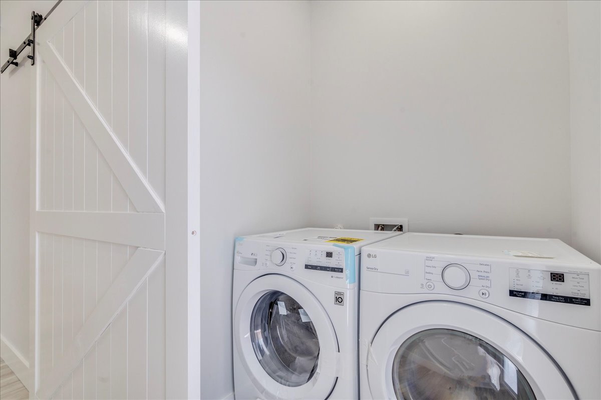 1215 Howard Street Taylor, TX 76574 - Photo 19 of 37 a utility room with dryer and washer