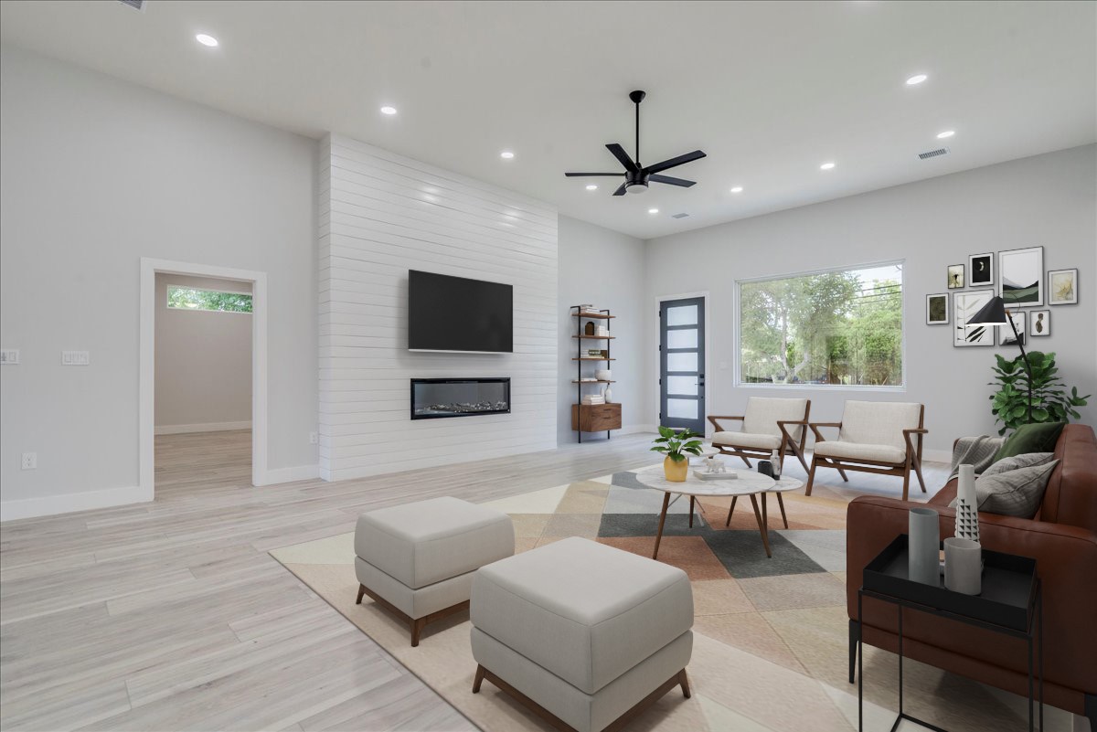 1215 Howard Street Taylor, TX 76574 - Photo 2 of 37 a living room with furniture and a flat screen tv