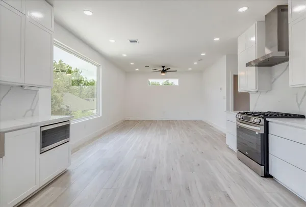 a view of a kitchen with a sink cabinets and a window